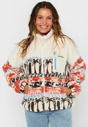 Fleece jack met rits, gekenmerkt door een crèmekleurige basis met rode, zwarte en blauwe palmboompatronen. Heeft een borstzak met een blauwe rits.