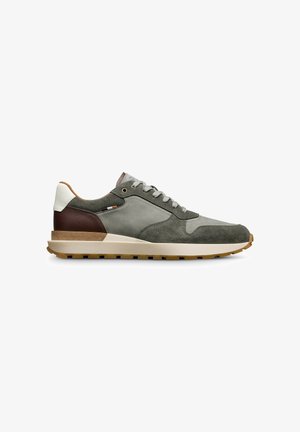 Men's sneakers in grey suede, featuring a cream and brown leather heel, textured details, and a light-colored rubber sole with traction.