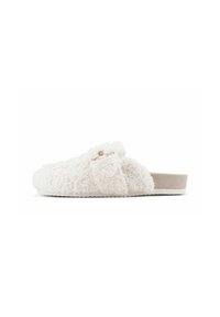 Fuzzy white slip-on slipper with a soft texture, featuring a plush upper, flat sole, and small decorative accents.