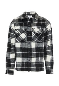 Chemise en flanelle à carreaux noir et blanc avec deux poches poitrine, boutonnage sur le devant, manches longues et tissu doux et texturé.