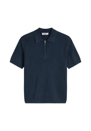 Polo en maille bleu marine à manches courtes avec texture côtelée et fermeture à moitié éclair à l'avant.