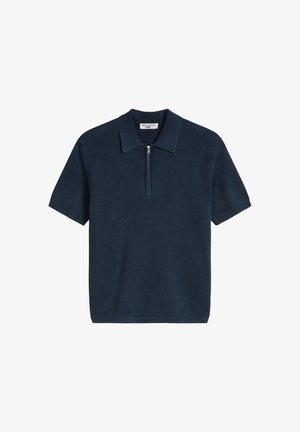 Polo en maille bleu marine à manches courtes avec texture côtelée et fermeture à moitié éclair à l'avant.