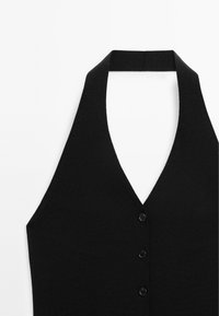 Black knitted halter top with a deep V-neck and five black buttons at the front. Smooth texture and fitted design.