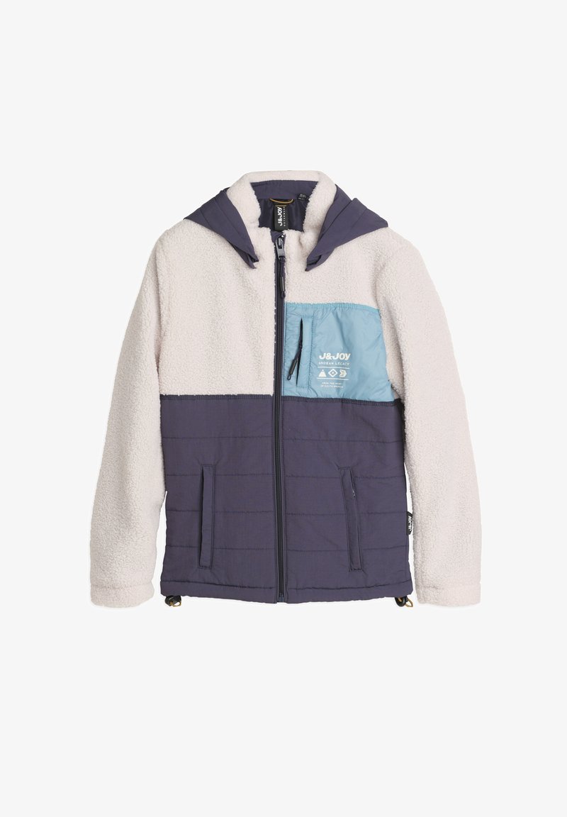 Fleece- en nylonjack met een capuchon, met een crèmekleurig lichaam, marineblauwe mouwen en een lichtblauwe borstzak met branding. Ritssluiting en zakken.