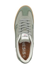 Gray suede sneaker with rubber gum sole, round toe, lace-up front, contrasting green accents, and cork insole labeled "42."