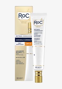 Tube de correcteur de rides Retinol Correxion, blanc avec des accents dorés, dans une boîte rectangulaire affichant des détails sur la protection SPF 30, l'hydratation et la réduction des rides.
