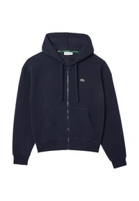 Navy zip-up hoodie made of soft fabric, featuring a drawstring hood, front pockets, and a small embroidered logo on the chest.