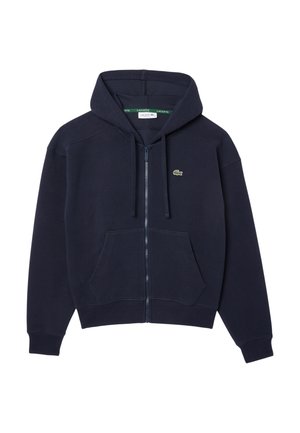 Navy zip-up hoodie made of soft fabric, featuring a drawstring hood, front pockets, and a small embroidered logo on the chest.