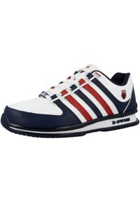 White athletic shoe with navy and red stripes, leather material, round toe, laced closure, and a black rubber outsole, featuring K-Swiss branding.