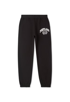 TUTA CON SCRITTA - Pantaloni sportivi - nero