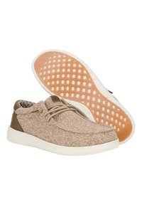 Scarpe in tessuto beige con accenti marrone chiaro e suole beige. Il design arrotondato presenta lacci e una suola in gomma con motivo antiscivolo.