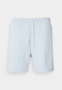 Shorts de bain bleu clair à côtes avec une taille élastique et un cordon de serrage. Comprend une petite étiquette en tissu sur la jambe gauche.