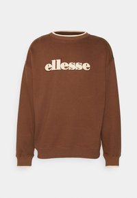 Hnědá mikina s lemovaným kruhovým výstřihem a elastickými manžetami. Na hrudi se nachází výrazné bílé logo "ellesse". Měkká tkanina.