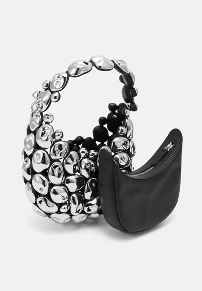 Black leather handbag with a textured silver bead-like exterior. Features a curved strap and a detachable black zippered pouch.