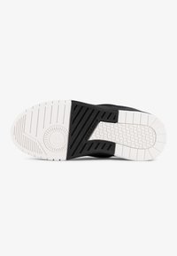 Black sneaker sole with white tread, featuring a textured surface and diagonal grooves, labeled with "PEGA DOR" in embossed lettering.