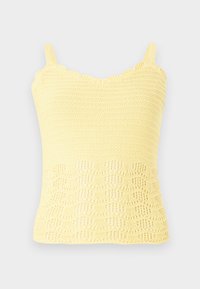 Kollane kootud singlet, millel on lainelised servad ja tekstureeritud muster, avatud kudumise detailidega alumises osas. Reguleeritavad rihmad.