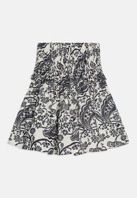 Marineblå og hvit blomstertrykt skjørt med smocket liv, med volanger og en utsvingt design. Laget av lett stoff.