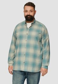 Męska koszula zapinana na guziki w jasnoniebieską i kremową kratę, z luźnym krojem, okrągłym kołnierzykiem oraz długimi rękawami z guzikami przy mankietach.
