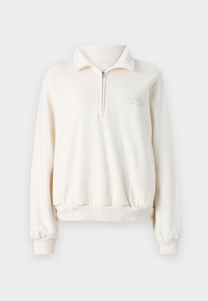 Sweatshirt zippé crème avec un col montant, des poignets élastiques et un ourlet. Présente le logo "Hollister Since 1922" en gris clair sur la poitrine.
