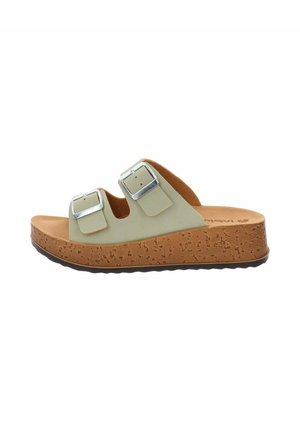 Sandalo open-toe con due fibbie regolabili in argento, cinturini beige e una suola platform spessa con texture in sughero e suola nera ondulata.