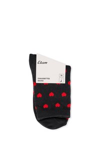 Calzini neri con motivi a cuori rosse, piegati con un'etichetta bianca che mostra il nome del marchio "Etam" e il testo "Chaussettes Socks."