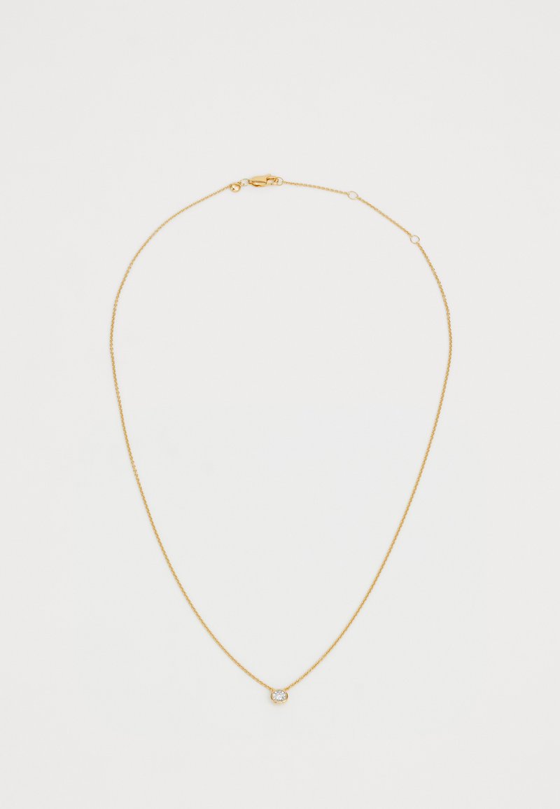 Collana in oro con un design delicato e sottile, caratterizzata da un piccolo pendente rotondo impreziosito da una chiara gemma scintillante.