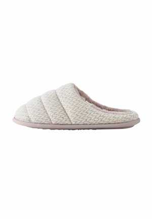 Quilted slipper in light pink and cream, made of soft fabric with a fuzzy interior, featuring a cushioned sole and minimal accent details.