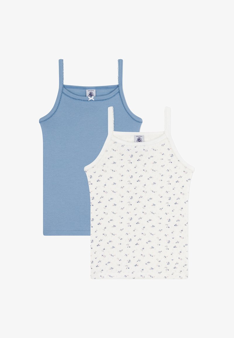 Two tank tops: one solid blue and one white with a small floral pattern. Both have thin straps and a soft, smooth texture.