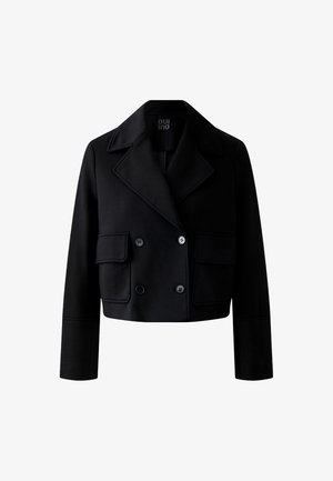 Veste noire coupée, à double boutonnage, avec de grands revers, deux poches à rabat avant et des manches longues.