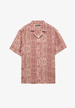 Koszula z krótkim rękawem zapinana na guziki, w czerwono-kremowy wzór w zygzak, wykonana z lekkiej tkaniny z kołnierzykiem.