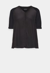 T-shirt de sport noir à manches courtes avec col en V, manches raglan et coupe légèrement ample, présenté sur un fond blanc uni.