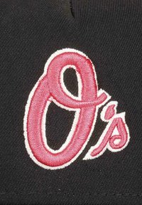 Black fabric featuring a prominent embroidered design of the letter "O" in pink with a white outline, accompanied by the letter "s."