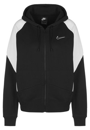 Sweat à capuche zippé noir et blanc Nike avec capuche à cordon et logo Nike brodé sur la poitrine gauche, présenté sur un fond blanc uni.