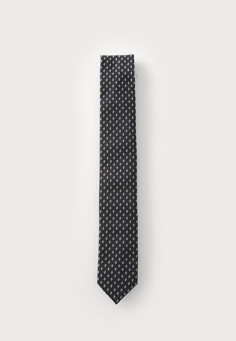 Black tie with a repeated white diamond pattern. Made of a smooth fabric, it features a pointed end and a narrow width.