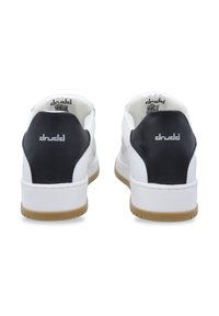 White sneakers with black heel accents, featuring a smooth leather finish, rubber soles, and branded details on the back.