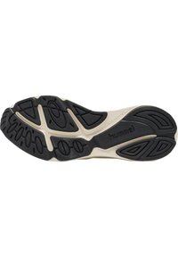 Svart och beige gummiskosula med texturerat mönster, som har kurvade spår och cirkulära detaljer; märkt med "hummel."