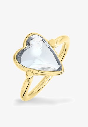 Gouden ring met een open hartvormige heldere edelsteen in het midden, met gladde, ronde randen en een gepolijste afwerking.