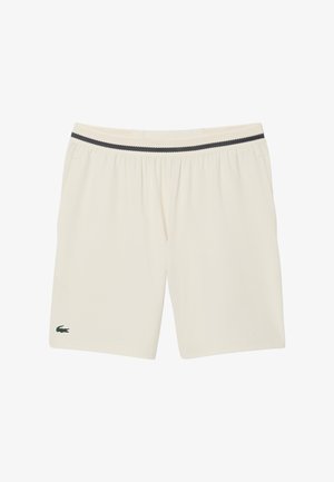 Crème-kleurige shorts met een geweven zwarte tailleband, voorzien van een groen krokodillologo op het linkerbeen en zijzakken. Gemaakt van lichtgewicht stof.