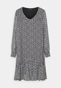 Schwarz-weiß gemustertes Kleid mit langen Ärmeln, V-Ausschnitt und ausgestelltem Saum. Leichter Stoff mit strukturierter Oberfläche.