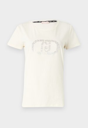 T-shirt color crema in cotone morbido con maniche corte e scollatura rotonda. Presenta un design del logo glitterato nella parte frontale.