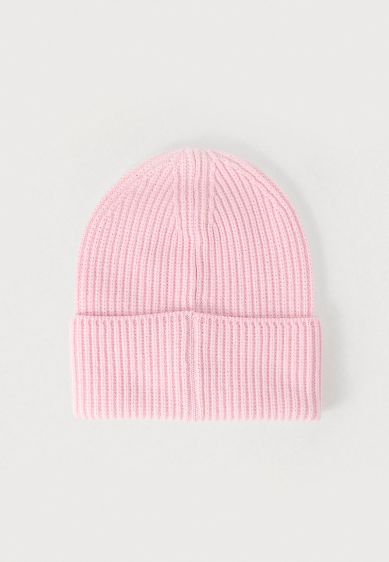 Pink knit beanie hat featuring vertical ribbed texture, a folded cuff, and a rounded top. Soft material, lightweight design.