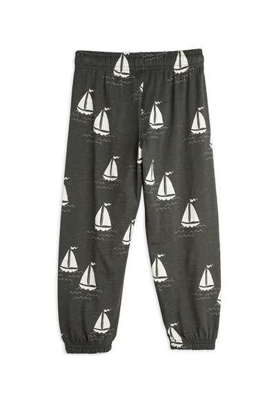 Gray cotton pants featuring a print of white sailboats and waves. Elastic waistband with gathered cuffs at the ankles. Suitable for casual wear.