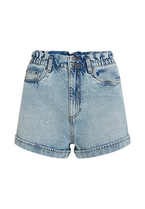 Valged teksapüksid hele sinise pesuga, millel on elastne vöökoht, lõhenevad ääred ja ees taskud. Vöökohal kahe nupuga kinnitamine.