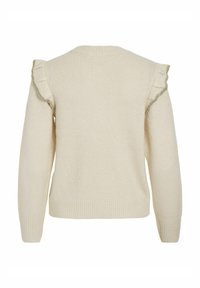 Kremowy sweter z falbankami na ramionach, z prążkowanymi mankietami i dołem. Wykonany z miękkiego materiału o strukturze, z okrągłym dekoltem.