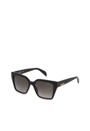 Lunettes de soleil carrées noires oversize avec des verres à dégradé foncé et un logo doré "TOUS" sur les branches.