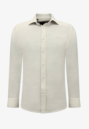 Licht beige lange mouwen shirt gemaakt van textuurstof. Kenmerkt zich door een klassieke kraag, knoopsluiting aan de voorkant en enkelvoudige knopen bij de mouwen. Subtiele logo op de borst.