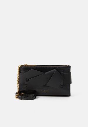 Black leather clutch with crocodile texture, featuring a large matte black ribbon detail and gold-tone chain strap. Minimalist logo embossed.