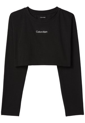 Zwart cropped shirt met lange mouwen, ronde hals en wit "Calvin Klein"-logo centraal op de borst.