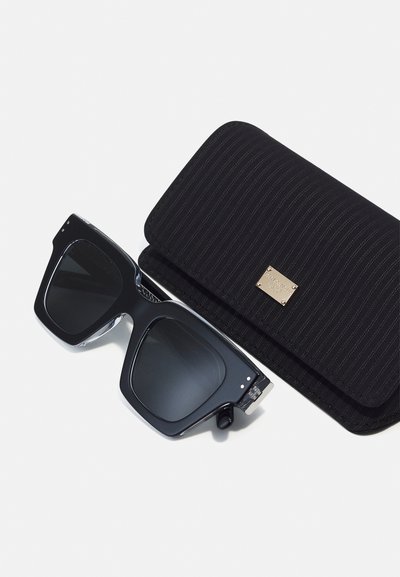 Black sunglasses with thick rectangular frames and dark lenses, accompanied by a matching black striped hard case featuring a metallic accent.