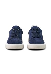 Pair of navy blue suede sneakers with white soles, black laces, and front view on a white background.